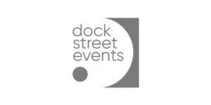 Grey logo featuring the words Dock Street Events in lowercase, centred over a white semicircle and a small grey circle, all set against a grey square background.
