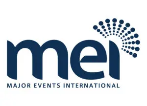 Dark blue MEI logo with a circular dotted design above the i and the words Major Events International in capital letters below.