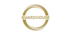 Gold circle with the word GUARDHOUSE in bold, uppercase letters centred inside on a white background, representing Guardhouse Europe and its trusted security services.