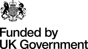 Black UK government crest above the words Funded by UK Government in large black letters on a light background, supporting safer venues and safer crowds for everyone by 2026.