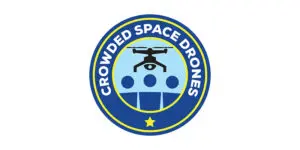 Circular logo featuring a drone above three blue circles, set against a blue background with a yellow border. The text “CROWDED SPACE DRONES”—representing industry-leading drone services—encircles the edge, complemented by a single yellow star at the bottom.
