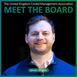 A man with light skin and short hair smiles at the camera, wearing a blue jacket. Text reads: The United Kingdom Crowd Management Association Meet the Board Members James Winsor.