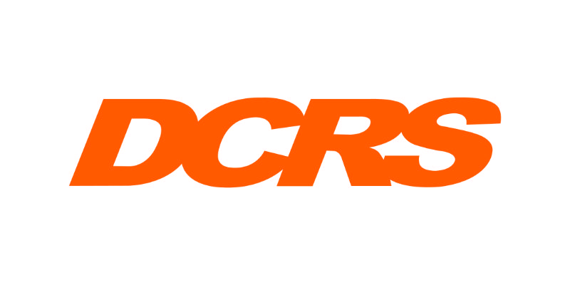 The image shows the bold orange letters DCRS in uppercase on a white background.