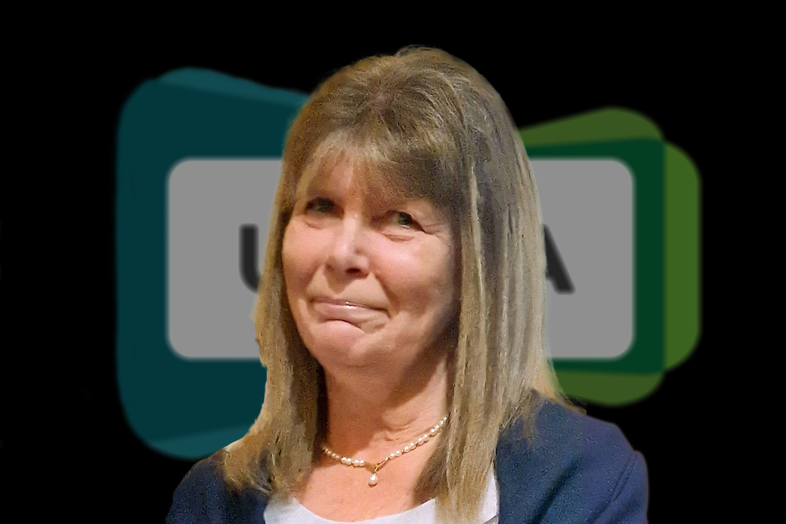 A middle-aged woman with straight, shoulder-length hair is standing in front of a blurred background with abstract shapes and letters, representing her achievements as one of the distinguished UKCMA Fellows.