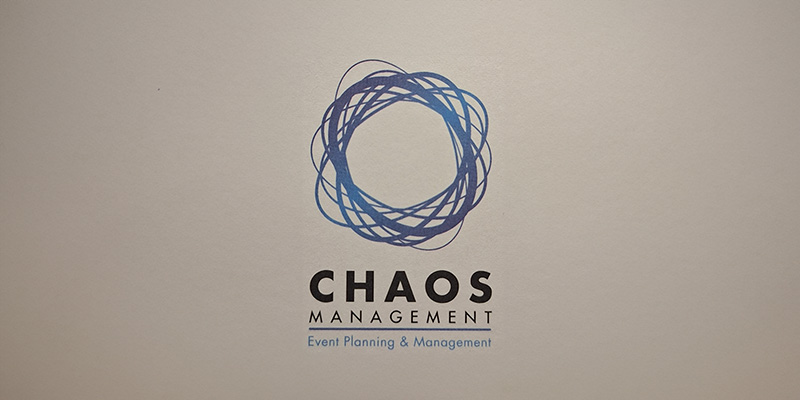 Logo for UK-based Chaos Management with a circular, tangled blue line design above the text Event Planning & Management.